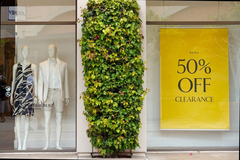 A sale sign greets shoppers at a retail store in California