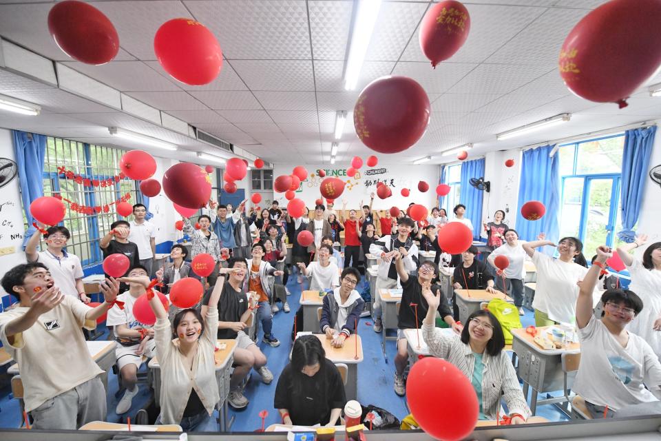 Senior three students throw balloons in the air to relieve stress ahead of the 2023 National College Entrance Exam (aka Gaokao) on June 6, 2023 in Changsha, Hunan Province of China. The 2023 National College Entrance Exam (aka Gaokao) will start from June 7.