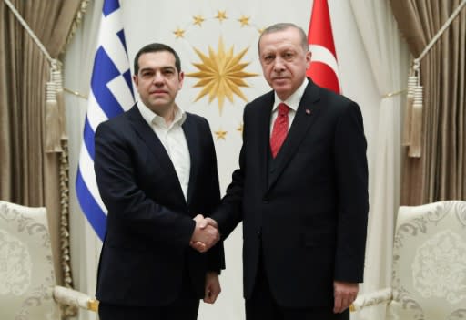 Greek Prime Minister Alexis Tsipras shakes hands with Turkish President Recep Tayyip Erdogan on his second visit in four years