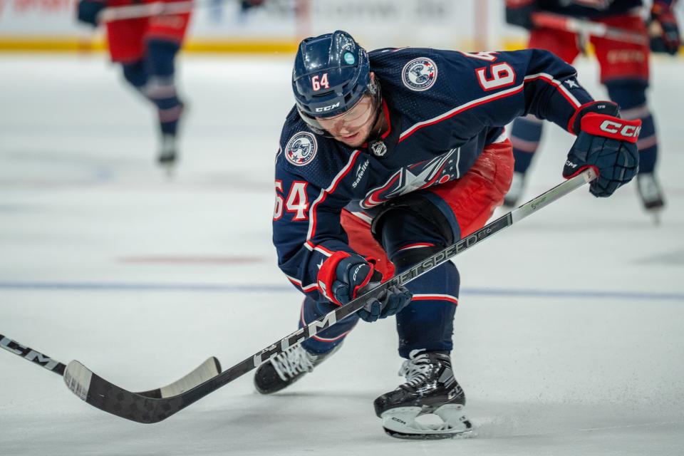 Oct. 5, 2023; Columbus, Ohio, United States;
Columbus Blue Jackets right wing Trey Fix-Wolansky (64) fights for the puck against Washington Capitals defenders during their game on Thursday, Oct. 5, 2023 at Nationwide Arena.