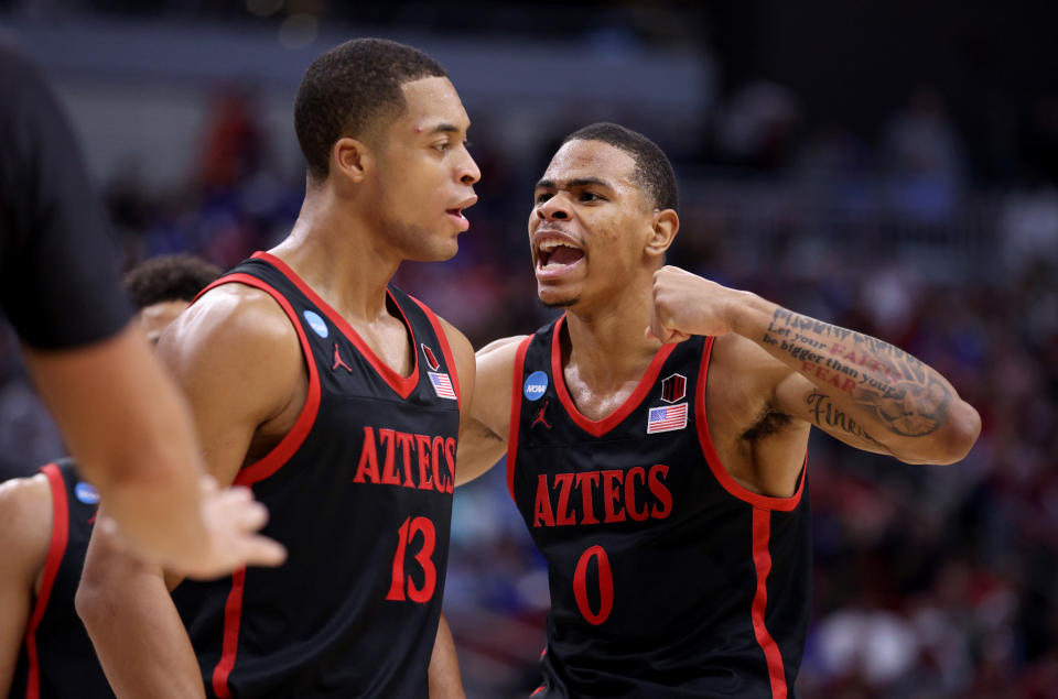 Mar 24, 2023; Louisville, KY, USA; San Diego State Aztecs forward Jaedon LeDee (13) and forward Keshad Johnson (0) celebrate after a play during the second half of the NCAA tournament round of sixteen against the Alabama Crimson Tide at KFC YUM! Center. Mandatory Credit: Jordan Prather-USA TODAY Sports