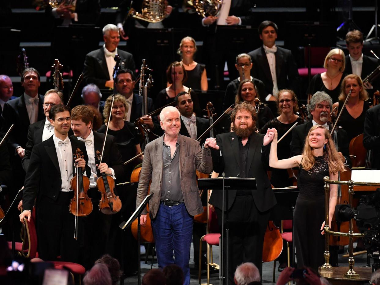 Composer Gerald Barry takes a bow with tenor Allan Clayton and conductor Mirga Gražinytė-Tyla following the world premiere of his work 'Canada' with the City of Birmingham Symphony Orchestra at the 2017 BBC Proms: BBC/ Chris Chistodoulou