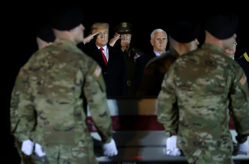 FILE PHOTO: U.S. President Donald Trump salutes the transfer case holding the remains of U.S. Army soldier Sergeant Gutierrez during a dignified transfer at Dover Air Force Base, in Dover, Delaware