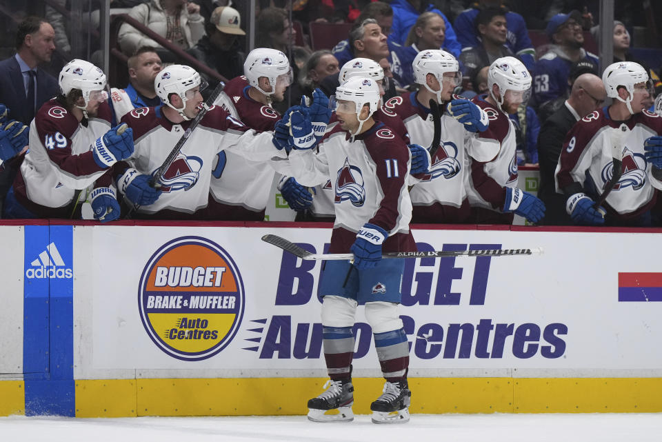 Colorado Avalanche's Andrew Cogliano (11) celebrates his goal against the Vancouver Canucks during the first period of an NHL hockey game Friday, Jan. 20, 2023, in Vancouver, British Columbia. (Darryl Dyck/The Canadian Press via AP)