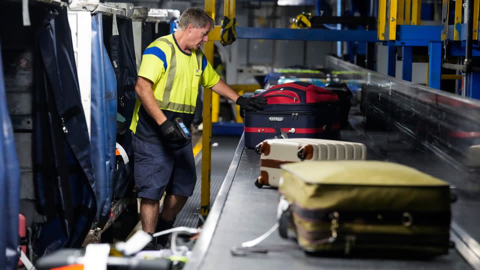 A baggage handler at George Bush Intercontinental Airport in Houston, Texas. - Brett Coomer/Houston Chronicle/Getty Images