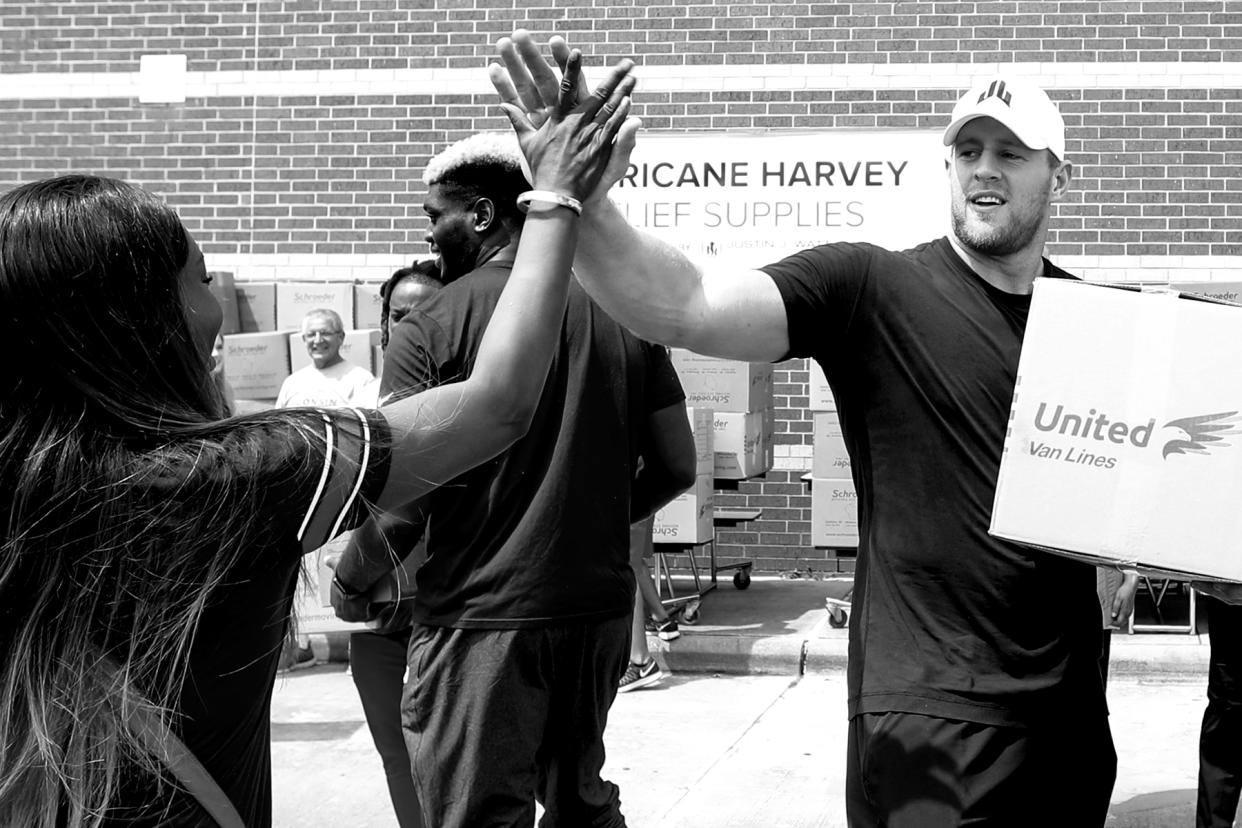 J.J. Watt loads a car with relief supplies for people impacted by Hurricane Harvey. Watt’s relief fund raised more than $41 million. (Getty)