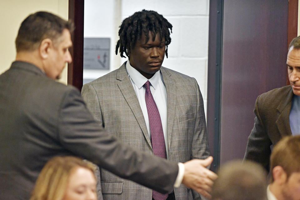 FILE - In this May 20, 2019, file photo, Emanuel Kidega Samson, 27, center, enters the courtroom in Nashville, Tenn. Samson, accused of fatally shooting one person and wounding seven others in a Nashville church in 2017, said Wednesday, May 22, he can't remember if he did it. (George Walker IV/The Tennessean via AP, Pool, File)