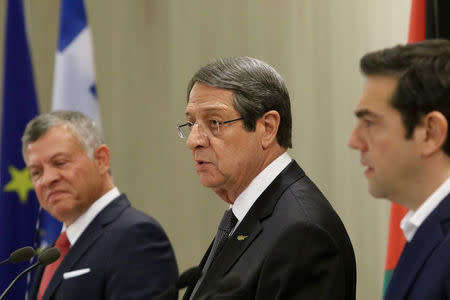 Cypriot President Nicos Anastasiades (C), Greek Prime Minister Alexis Tsipras (R) and Jordan's King Abdullah attend a news conference at the Presidential Palace in Nicosia, Cyprus January 16, 2018. REUTERS/Yiannis Kourtoglou