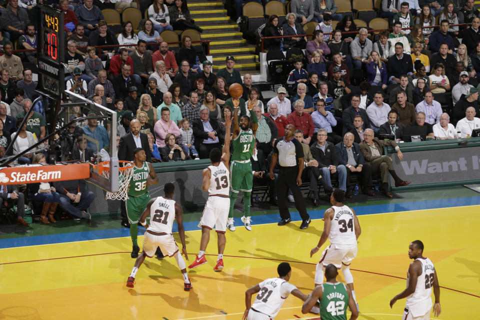 Kyrie Irving rises and fires during the Celtics’ road win over the Bucks. (Getty)