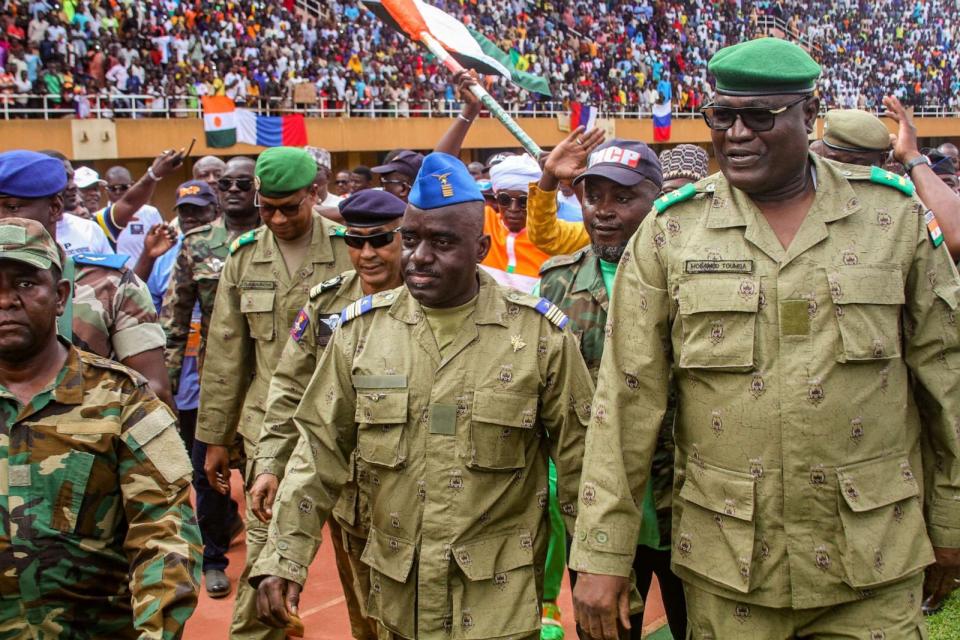PHOTO: Members of a Nigerien military council that staged an apparent coup attend a rally at a stadium in Niamey, Niger, on Aug. 6, 2023. (Mahamadou Hamidou/Reuters, FILE)