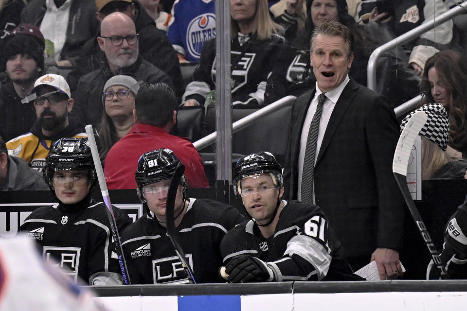 Los Angeles Kings interim head coach Jim Hillier yells out from behind the bench during the first period of an NHL hockey game against the Edmonton Oilers in Los Angeles, Saturday, Feb. 10, 2024. (AP Photo/Alex Gallardo)