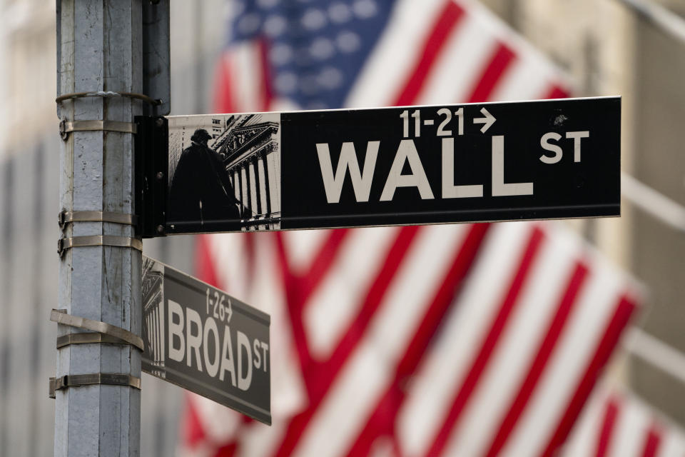 FILE - Street signs at the intersection of Wall and Broad Streets are shown in lower Manhattan, Wednesday, Oct. 13, 2021. (AP Photo/John Minchillo, File)