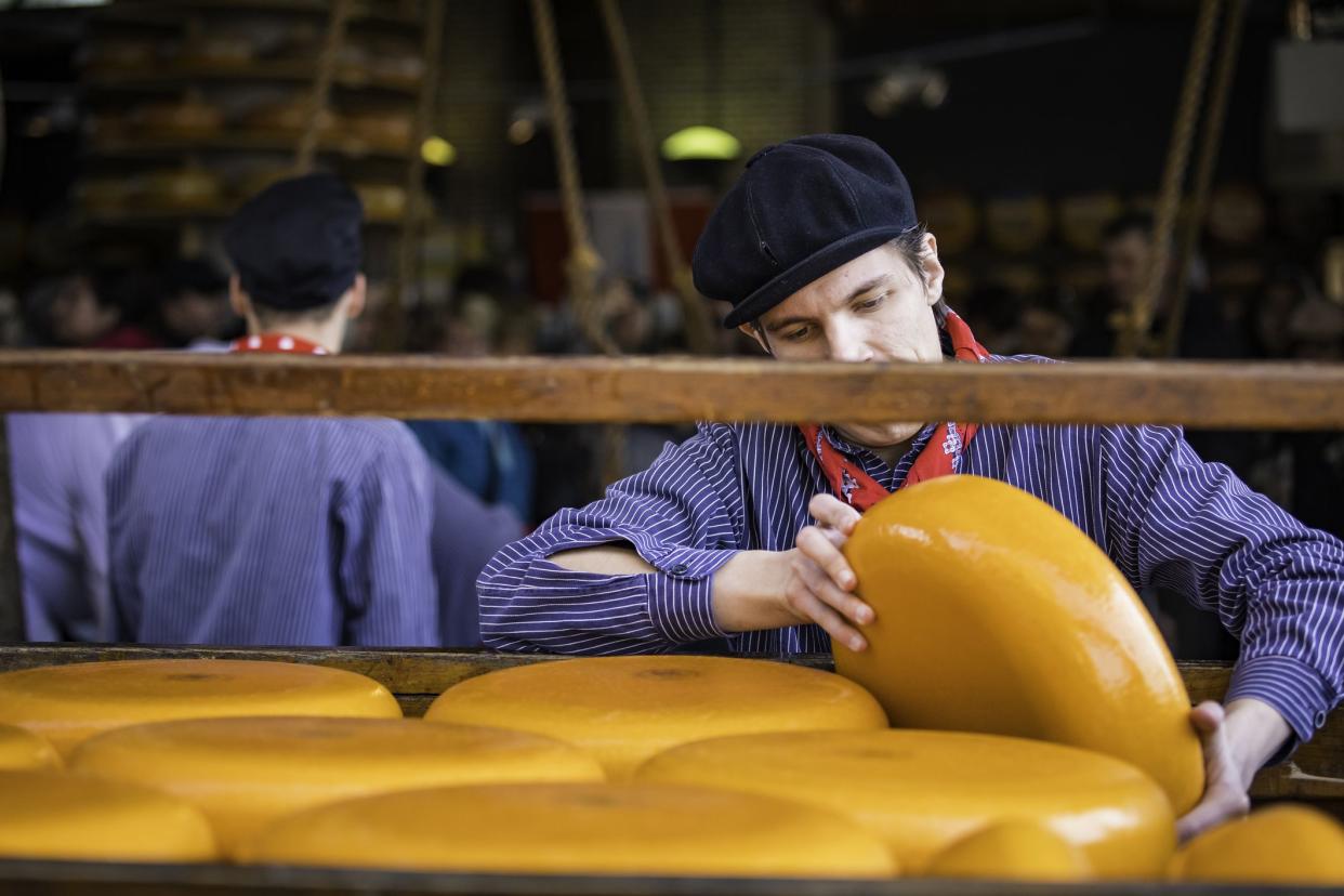 cheese handler at gouda cheese market