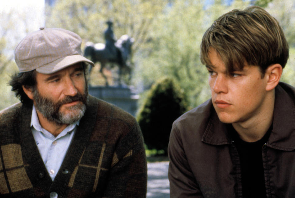 Sean Maguire and Will Hunting sitting in a park