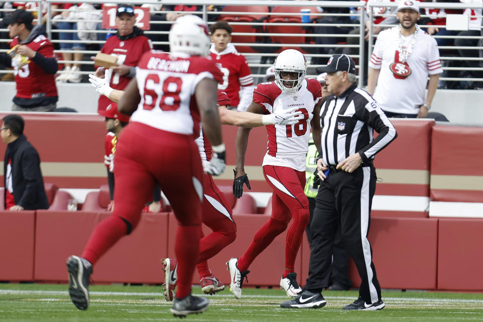 Arizona Cardinals wide receiver A.J. Green, middle right, is congratulated by teammates after scoring against the San Francisco 49ers during the first half of an NFL football game in Santa Clara, Calif., Sunday, Jan. 8, 2023. (AP Photo/Jed Jacobsohn)