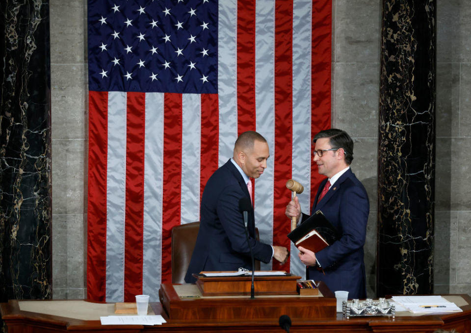 House Minority Leader Hakeem Jeffries hands the gavel to newly elected Speaker of the House Mike Johnson on Oct. 25, 2023. / Credit: Chip Somodevilla/Getty Images