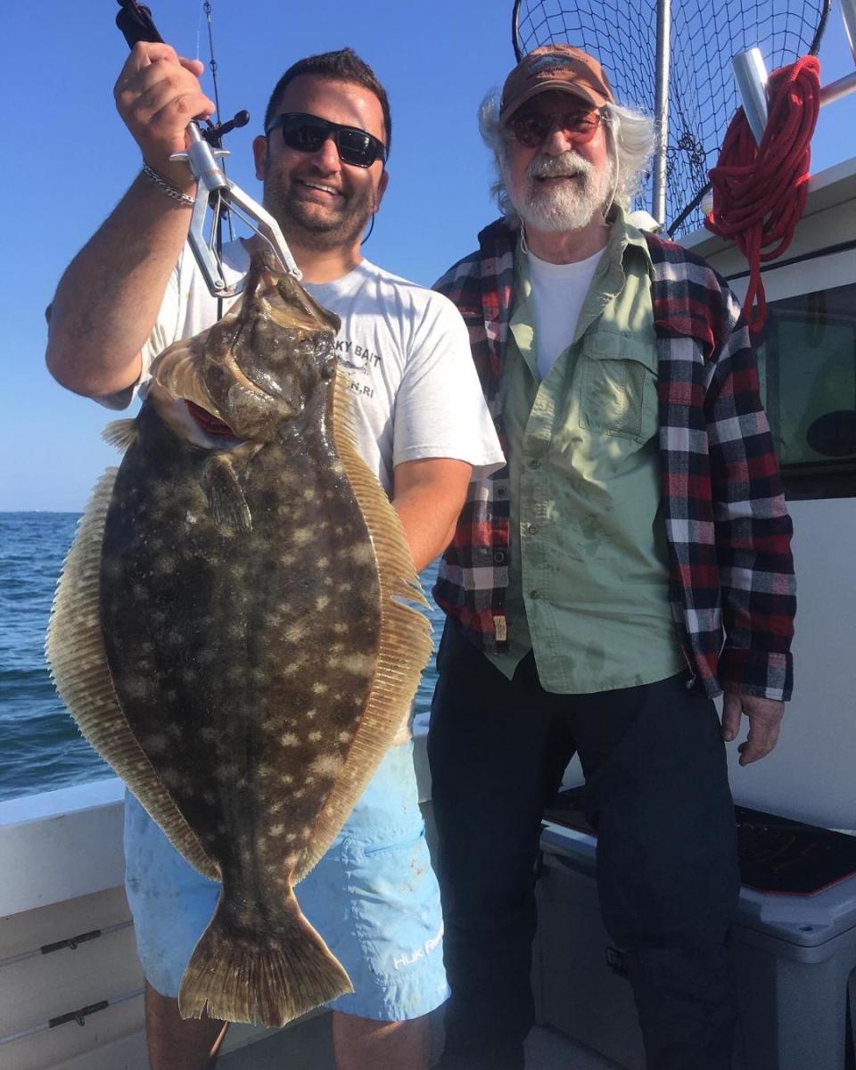 Bob Hurrie and Capt. Kurt Rivard with the 13-pound summer flounder (fluke) they caught off Newport.