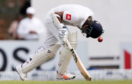 Cricket - Sri Lanka v South Africa -Second Test Match - Colombo, Sri Lanka - July 20, 2018 - Sri Lanka's Dimuth Karunaratne tries to avoid the ball hitting on him while running between wickets. REUTERS/Dinuka Liyanawatte