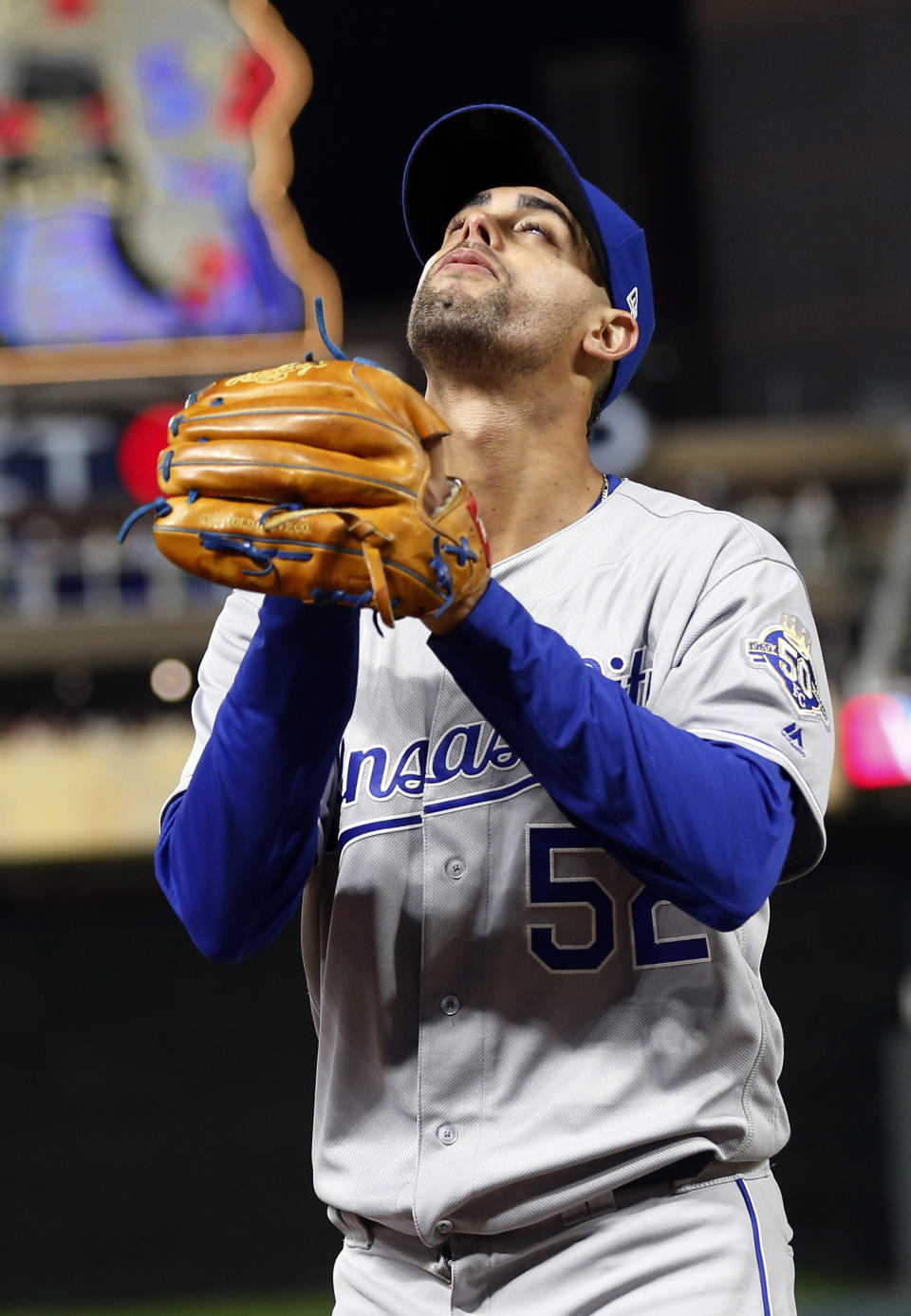 Kansas City Royals pitcher Jorge Lopez looks skyward as he heads to the dugout after being pulled after going into the ninth inning with a perfect game against the Minnesota Twins in a baseball game Saturday, Sept. 8, 2018, in Minneapolis. The Royals won 4-1. (AP Photo/Jim Mone)