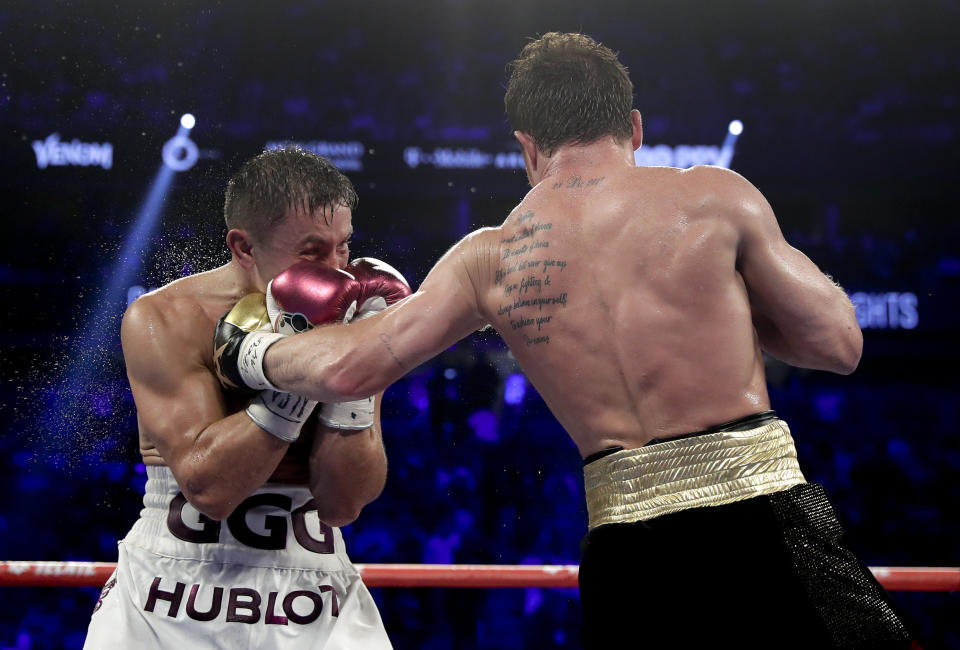 Canelo Alvarez, right, lands a punch against Gennady Golovkin in the eighth round during a middleweight title boxing match, Saturday, Sept. 15, 2018, in Las Vegas. (AP Photo/Isaac Brekken)