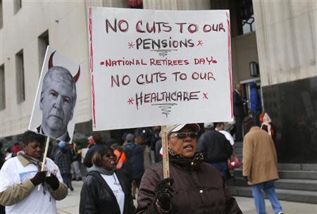 Protesters demonstrate against cuts in Detroit city workers' pensions and healthcare, outside Theodore Levin U.S. Courthouse during Detroit's bankruptcy eligibility trial in Detroit, Michigan October 28, 2013. REUTERS/Rebecca Cook