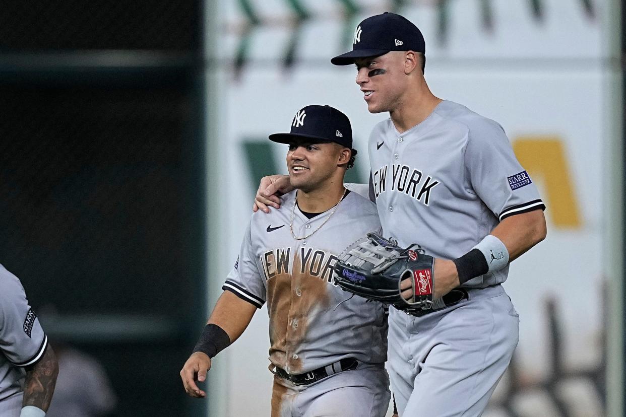 New York Yankees center fielder Jasson Dominguez is embraced by right fielder Aaron Judge after the team's baseball game against the Houston Astros, Saturday, Sept. 2, 2023, in Houston. (AP Photo/Kevin M. Cox)