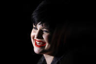 Actress Kelly Osbourne smiles before Vivienne Westwood's Autumn/Winter 2008 show at London Fashion Week February 14, 2008. REUTERS/Alessia Pierdomenico (BRITAIN)