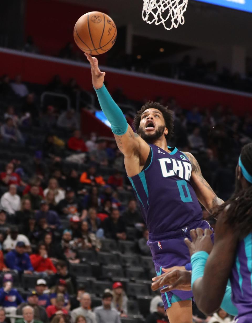 Charlotte Hornets forward Miles Bridges scores against the Detroit Pistons on Feb. 11, 2022 at Little Caesars Arena.