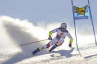 Switzerland's Marco Odermatt speeds down the course during an alpine ski, men's World Cup giant slalom in Soelden, Austria, Sunday, Oct. 18, 2020. (AP Photo/Giovanni Auletta)