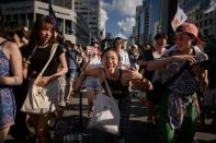 Tens of thousands of gay rights supporters march through the streets of Seoul