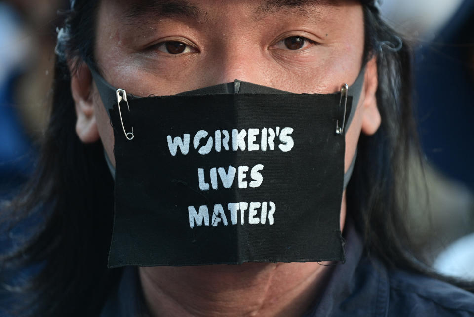 <p>A man attends a protest against the hosting of the Tokyo 2020 Olympic Games in Tokyo on July 23, 2021. (Photo by Philip FONG / AFP) (Photo by PHILIP FONG/AFP via Getty Images)</p> 