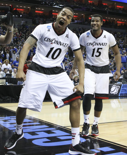 Troy Caupain (left) celebrates his game-tying basket to force OT. (AP)