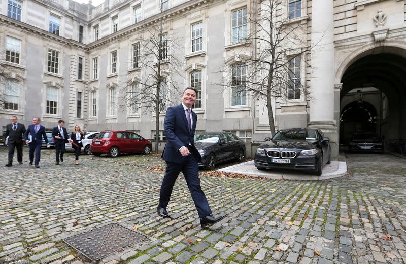 FILE PHOTO: FILE PHOTO: Irish Finance Minister Paschal Donohoe walks outside Government Buildings in Dublin