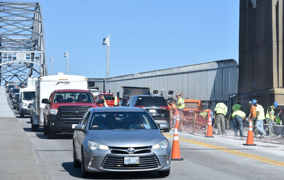 Crews use jackhammers to break up pavement Tuesday morning on the Cape Cod side of the Bourne Bridge in Bourne as bridge maintenance work gets underway. The work, which includes lane restrictions, is expected to continue into November.