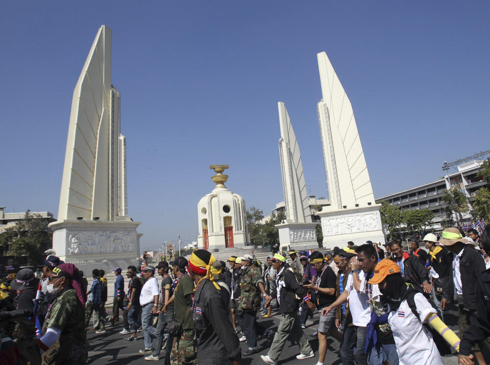 Anti-government protesters gather for a rally front of Democracy Monument, Wednesday, Jan. 15, 2014, in Bangkok, Thailand. Gunshots rang out in the heart of Thailand's capital overnight in an apparent attack on anti-government protesters early Wednesday that wounded at least two people and ratcheted up tensions in Thailand's deepening political crisis. (AP Photo/Sakchai Lalit)