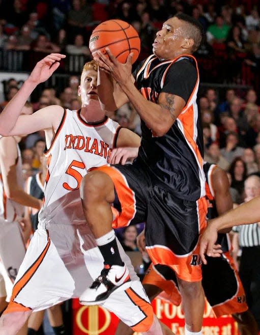 Manual's Marvin Jordan drives to the basket during a 2010 Class 2A supersectional basketball game against Winnebago.