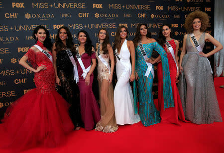 Miss Universe candidates pose for a picture during a red carpet inside a SMX convention in metro Manila, Philippines January 29, 2017. REUTERS/Romeo Ranoco