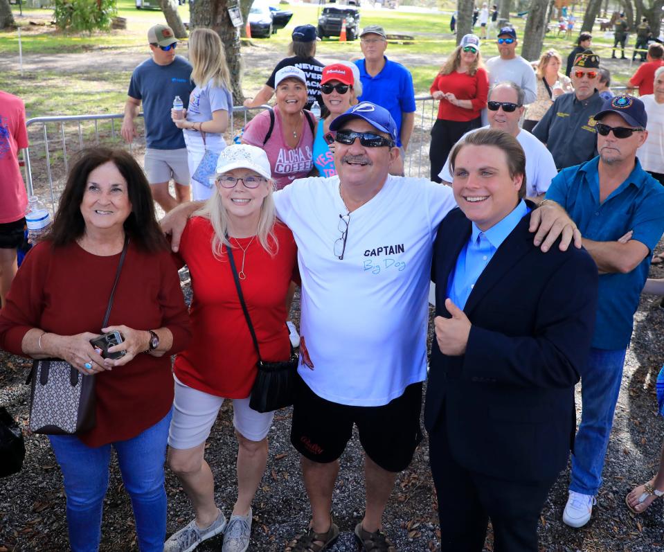 Eighteen-year-old Diezel Depew, right, who is running for mayor of Edgewater, poses with supporters at Florida Gov. Ron DeSantis's campaign event at the 2A Ranch in Ormond Beach on Saturday, Nov. 5th, 2022.