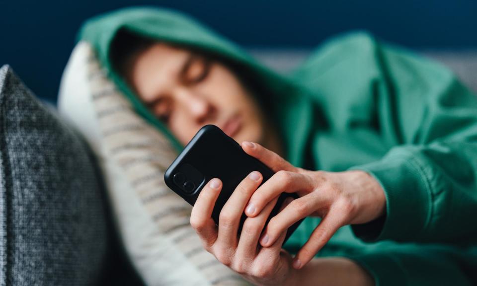 <span>Researchers said there are some similarities between problematic smartphone use and substance or behavioural addictions.</span><span>Photograph: miniseries/Getty Images</span>