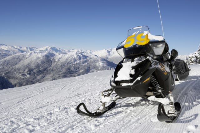 Snowmobile parked on snow