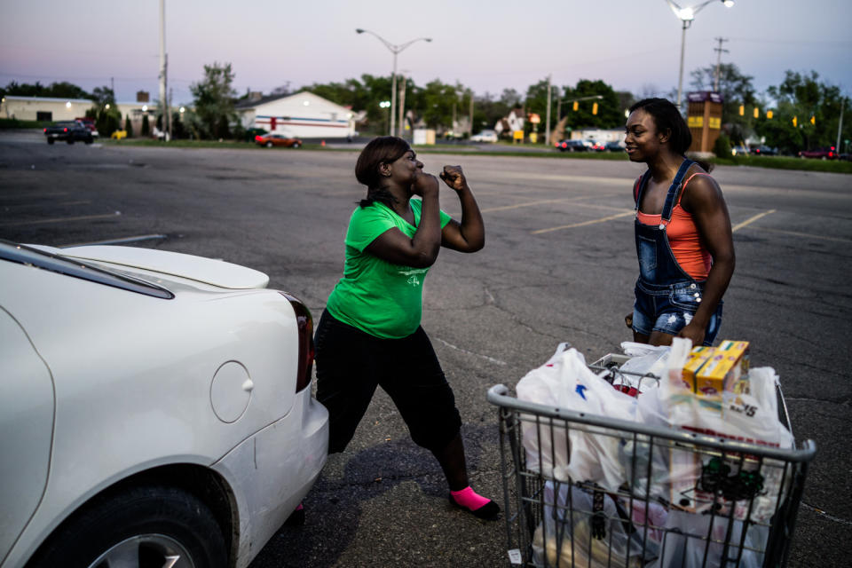 <p>Olympic Gold Medal Boxer Claressa “T-Rex” Shields (R) and her sister Brianna (17 years old) play fight in a supermarket parking lot in Flint, Michigan. May 2014. (Photograph by Zackary Canepari) </p>