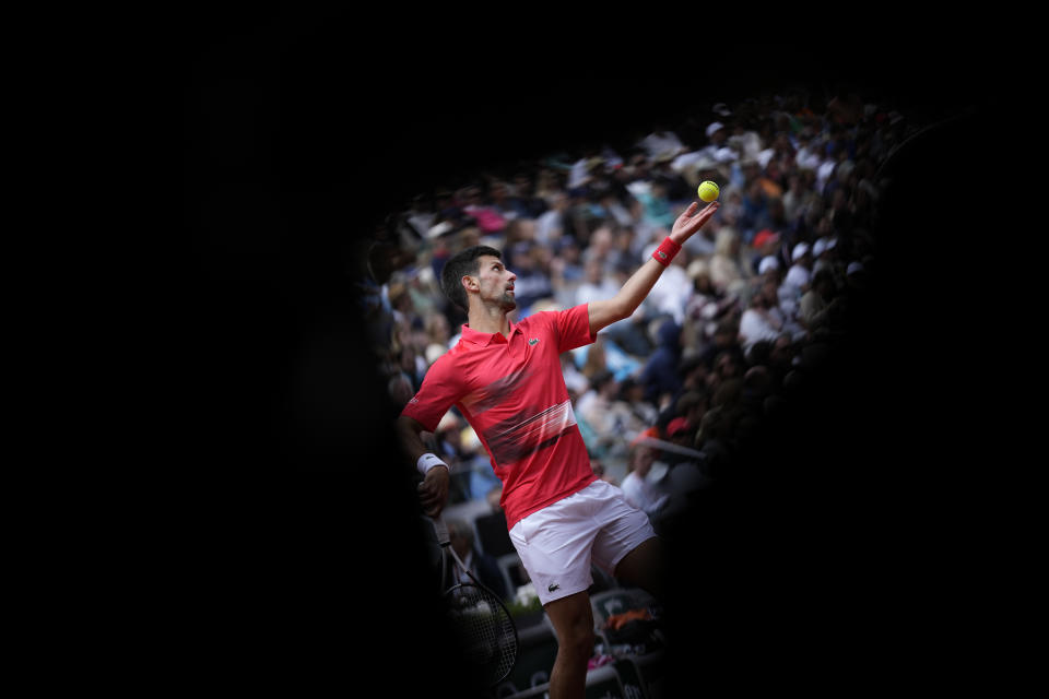 Serbia's Novak Djokovic serves against Argentina's Diego Schwartzman during their fourth round match at the French Open tennis tournament in Roland Garros stadium in Paris, France, Sunday, May 29, 2022. (AP Photo/Christophe Ena)