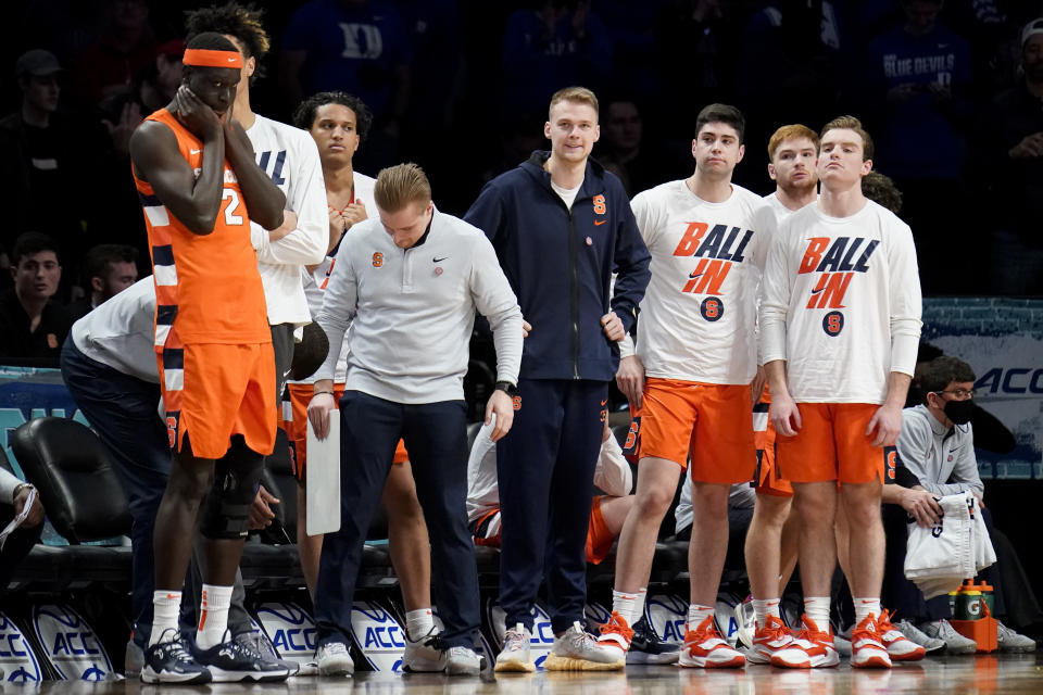 Syracuse's Buddy Boeheim, center, and his bench reacts in the final seconds of the second half of an NCAA college basketball game against Duke during quarterfinals of the Atlantic Coast Conference men's tournament, Thursday, March 10, 2022, in New York. (AP Photo/John Minchillo)