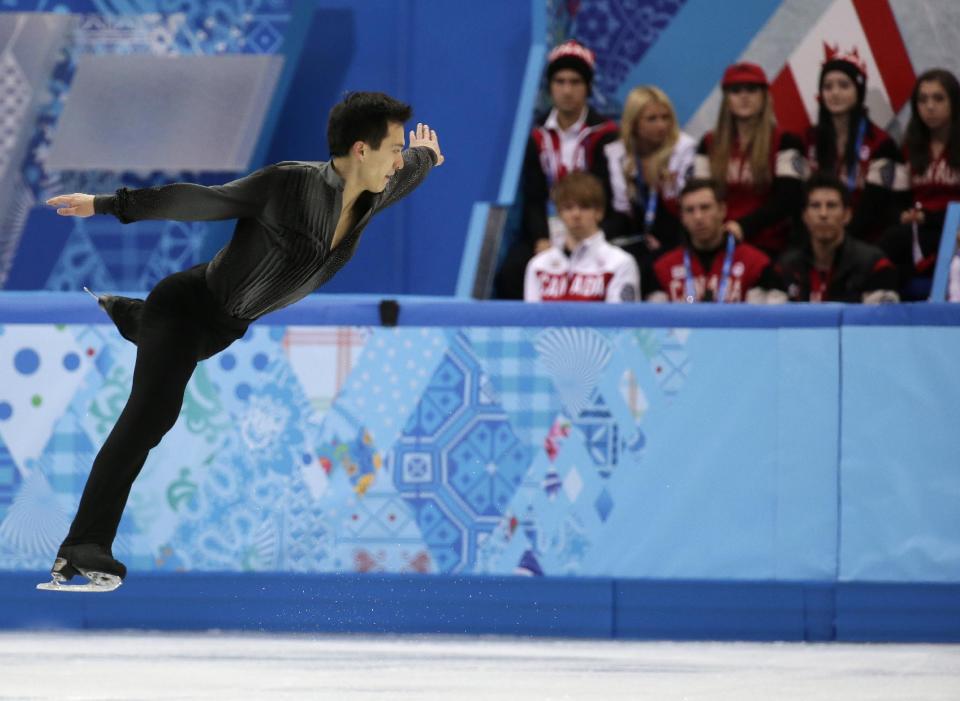 Patrick Chan of Canada competes in the men's team short program figure skating competition at the Iceberg Skating Palace during the 2014 Winter Olympics, Thursday, Feb. 6, 2014, in Sochi, Russia. (AP Photo/Bernat Armangue)