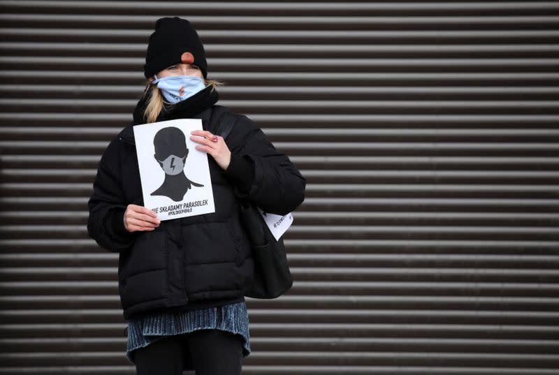 An activist protests against an initiative to tighten abortion rules in Krakow