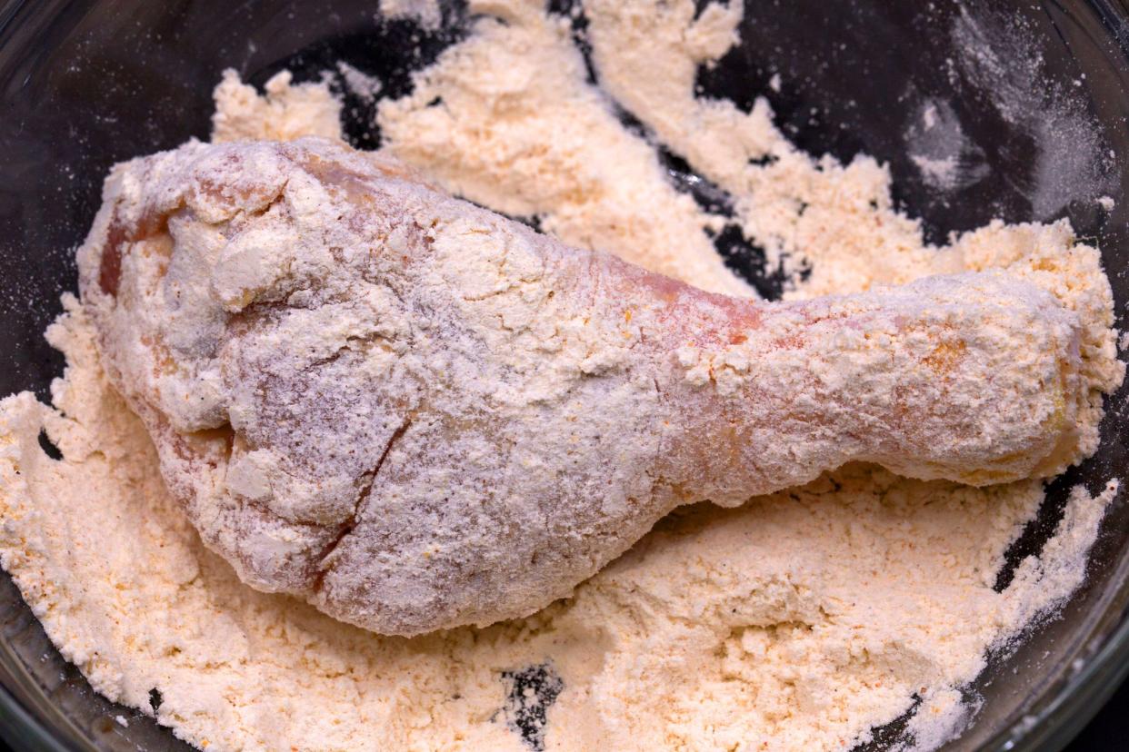 chicken drumstick in seasoned flour