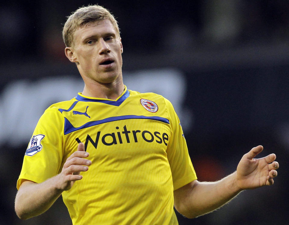 FILE - In this Tuesday, Jan. 1, 2013 file photo, Reading's Pavel Pogrebnyak reacts as he plays against Tottenham Hotspur during their English Premier League soccer match at White Hart Lane, London. Russian striker Pavel Pogrebnyak has on Tuesday, March 26, 2019 been fined for remarks he made about black players on the Russia national team. Pogrebnyak told Russian newspaper Komsomolskaya Pravda this month that he didn’t believe Brazil-born Ari should play for Russia, adding “it’s funny when a dark-skinned player plays for the Russia team.” (AP Photo/Sang Tan, file)