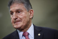 FILE - In this Feb. 5, 2020, file photo, Sen. Joe Manchin, D-W.Va., speaks with reporters on Capitol Hill in Washington. A bipartisan group of lawmakers, including Manchin, is putting pressure on congressional leaders to accept a split-the-difference solution to the months-long impasse on COVID-19 relief in a last-gasp effort to ship overdue help to a hurting nation before Congress adjourns for the holidays. (AP Photo/Patrick Semansky, File)