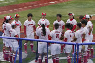 The Japan team talks after a loss to the United States in a softball game at the 2020 Summer Olympics, Monday, July 26, 2021, in Yokohama, Japan. (AP Photo/Sue Ogrocki)