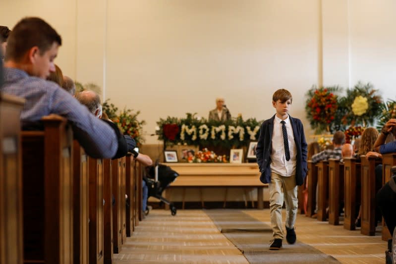 Relatives of Christina Marie Langford Johnson, who was killed by unknown assailants, attend her funeral service before a burial at the cemetery in LeBaron, Chihuahua